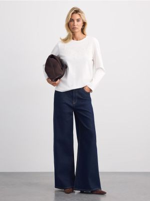 Jeansy damskie Mohito ze sklepu: Mohito w kategorii: Jeansy damskie - zdjęcie 55A556F-010-6967_084KG