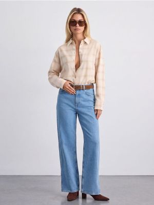 Jeansy damskie w miejskim stylu Mohito ze sklepu: Mohito w kategorii: Jeansy damskie - zdjęcie 55A556F-010-6967_090KG