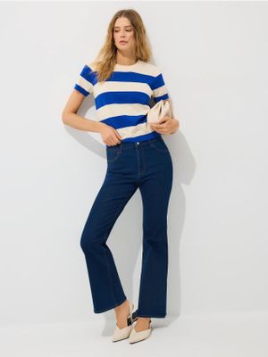 Jeansy damskie w miejskim stylu Mohito ze sklepu: Mohito w kategorii: Jeansy damskie - zdjęcie 55A556F-010-6967_635IH