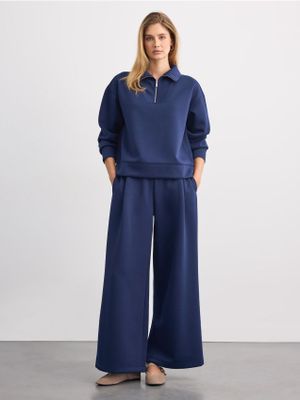 Spodnie damskie retro Mohito ze sklepu: Mohito w kategorii: Spodnie damskie - zdjęcie 55A556F-010-6967_717LA