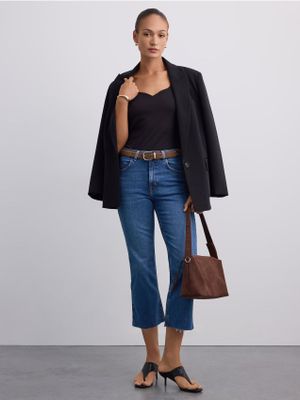 Jeansy damskie w miejskim stylu Mohito ze sklepu: Mohito w kategorii: Jeansy damskie - zdjęcie 55A556F-010-6967_996KN