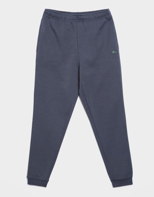 Spodnie męskie jesienne Lacoste ze sklepu: JD Sports  w kategorii: Spodnie męskie